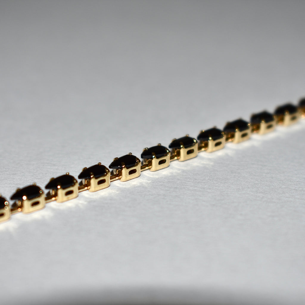 Classic Tennis Bracelet – Gold & Black Elegance